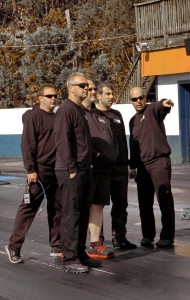 Chris Rini (2nd from right), discusses track conditions with his crew at Piedmont Dragway.