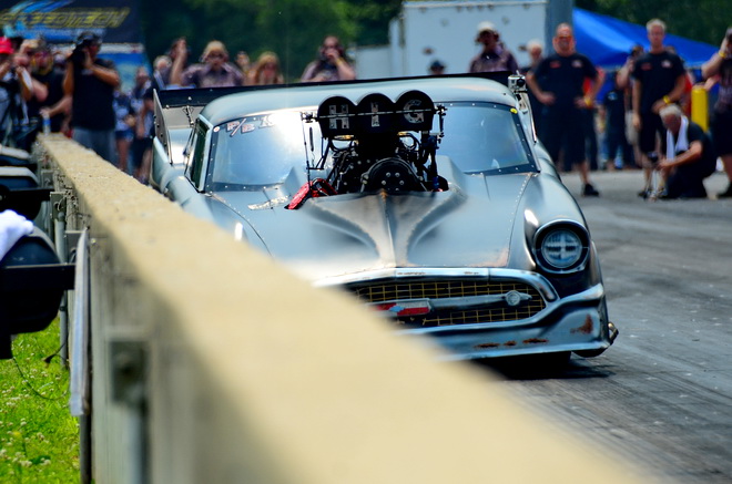 In Saturday's third and final round of Pro Boost qualifying, Larry Higgenbotham came as close as possible to scraping the wall without so much as a scratch on his '57 Chevy.  Higgenbotham won his first round of racing with a holshot against Bill Lutz.  