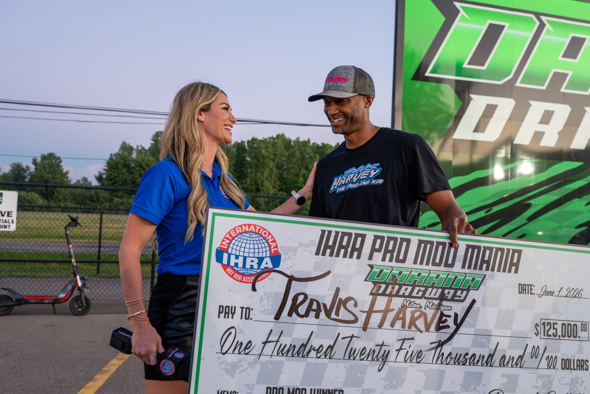 Travis Harvey accepts the 5,000 IHRA Pro Mod Mania winner's check at Milan Dragway.