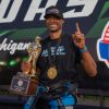 Travis Harvey hoists the IHRA Pro Mod Mania trophy at Milan Dragway.