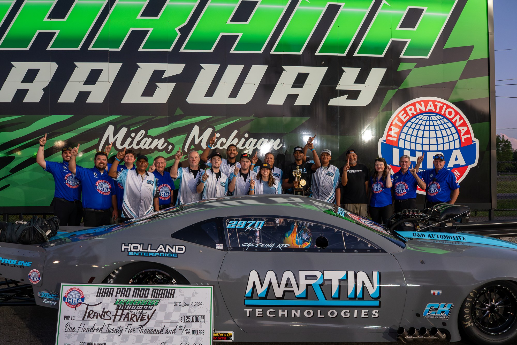 Travis Harvey and his team in the winner's circle at IHRA Pro Mod Mania at Milan Dragway.