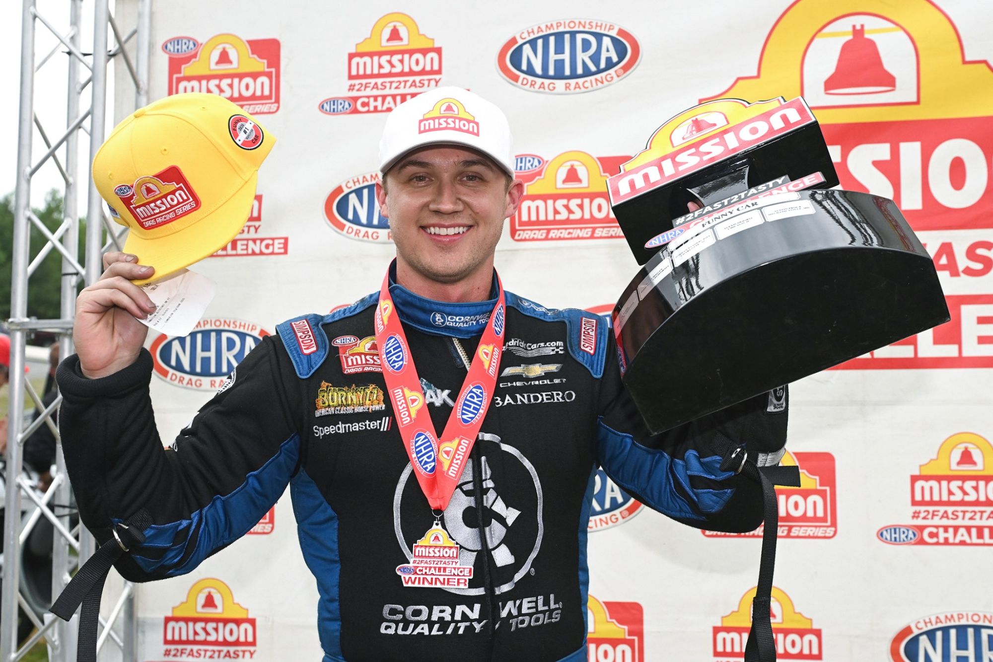 Jordan Vandergriff celebrates his Mission #2Fast2Tasty Challenge Funny Car win at the NHRA New England Nationals.