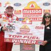 Doug Kalitta with the Mission #2Fast2Tasty Challenge trophy at the NHRA New England Nationals.