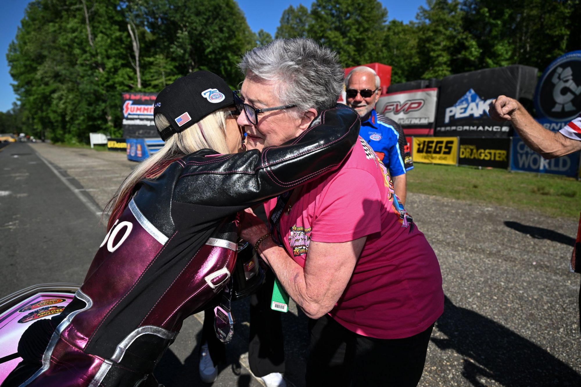 Angie Smith with three-time Top Fuel world champion Shirley Muldowney after Smith captured the 200th NHRA Mission Foods Drag Racing Series win by a woman.