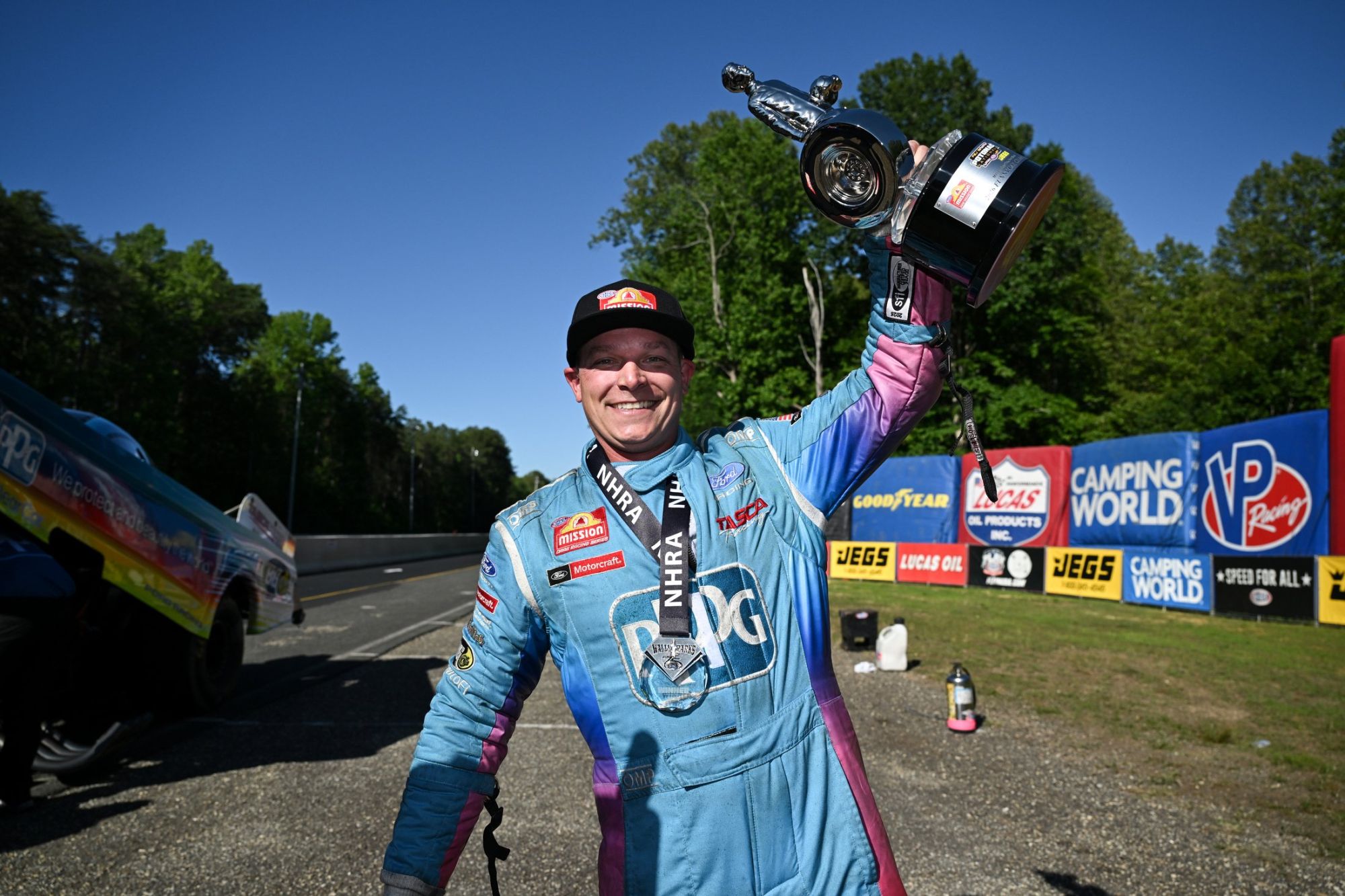 Austin Prock and the PPG Tasca Racing Ford Mustang celebrate winning the 2026 inaugural NHRA Potomac Nationals.