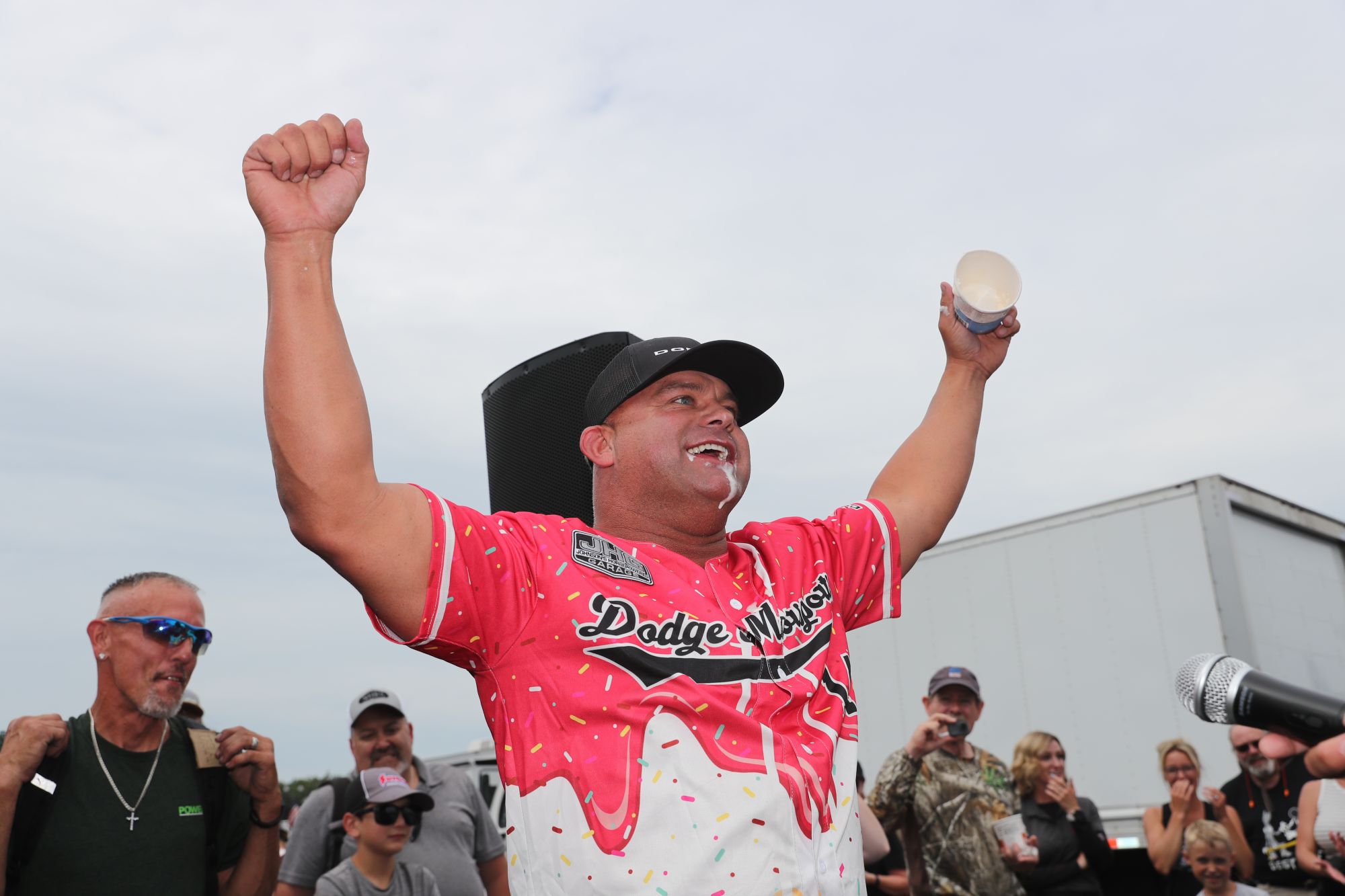 Matt Hagan celebrates winning the Summit Motorsports Park ice cream eating contest