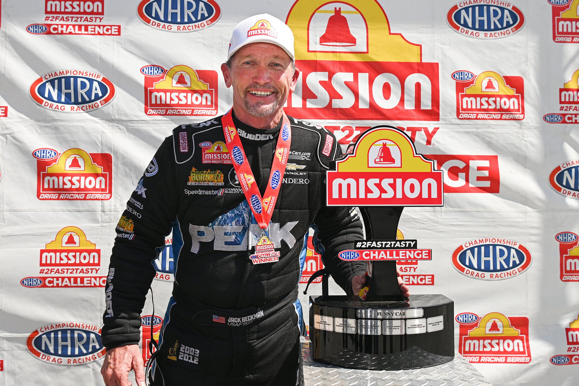 Jack Beckman with the Mission Foods #2Fast2Tasty Funny Car trophy at the 2026 Super Grip NHRA Thunder Valley Nationals at Bristol Dragway.