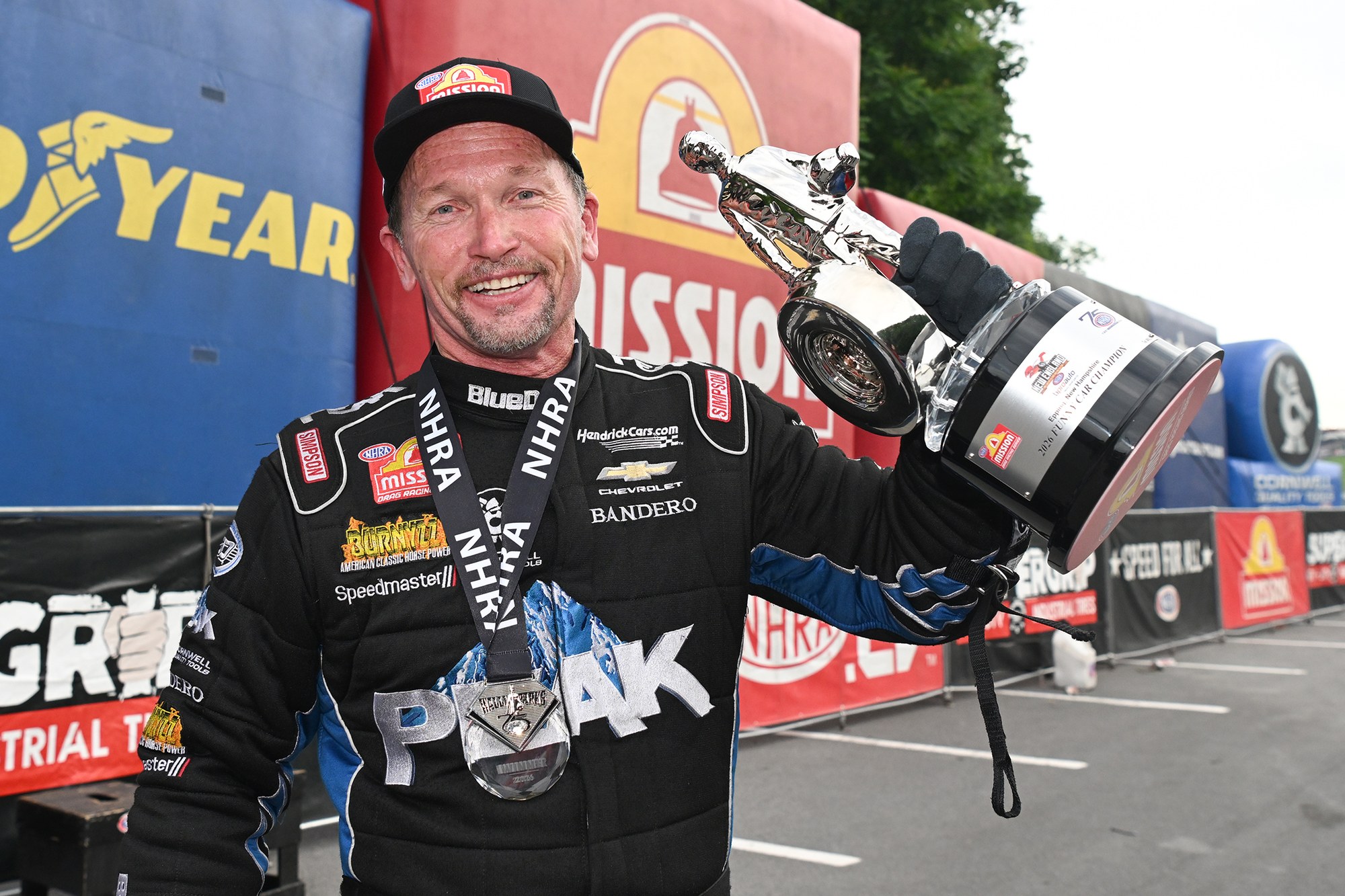 Jack Beckman celebrates the NHRA New England Nationals Funny Car victory at Bristol after the rained-out Epping final.