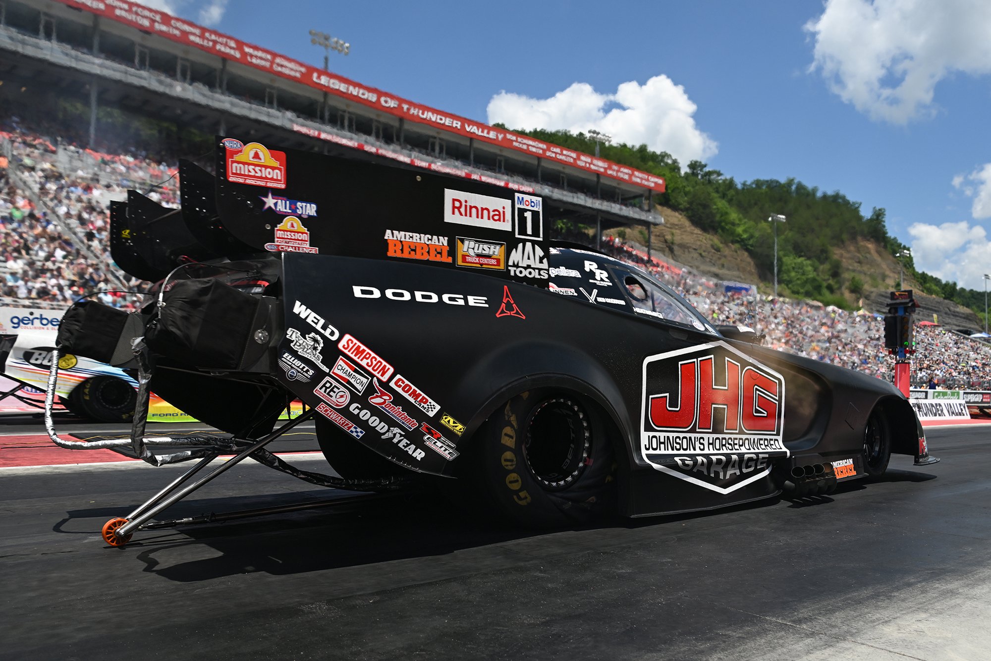 Matt Hagan launches the JHG Mopar Dodge Charger Funny Car at the 2026 Super Grip NHRA Thunder Valley Nationals at Bristol Dragway.