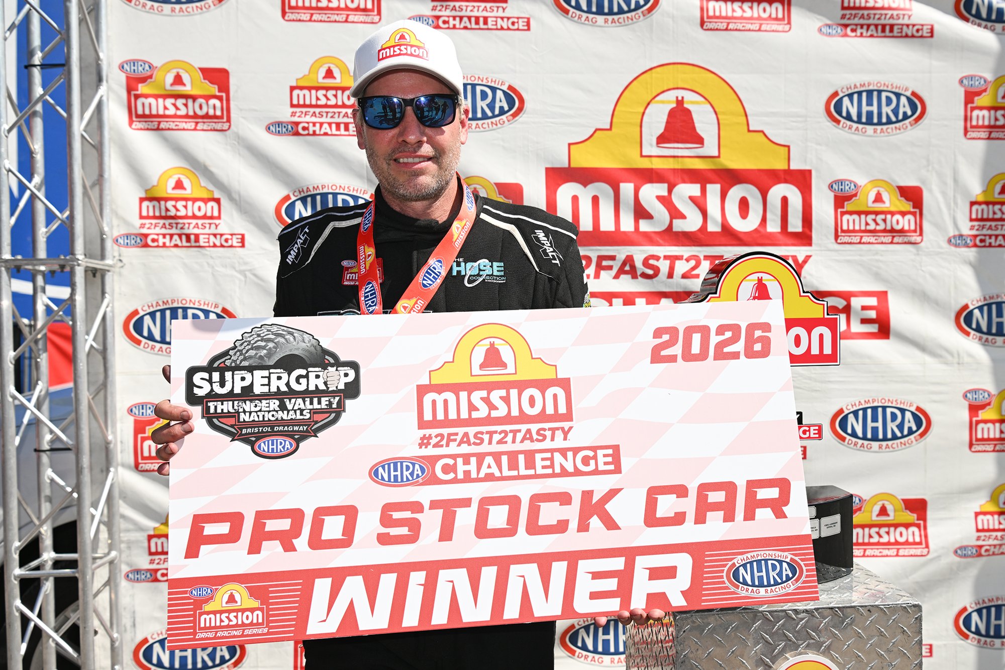Matt Hartford with the Mission Foods #2Fast2Tasty Pro Stock winner check at the 2026 Super Grip NHRA Thunder Valley Nationals.