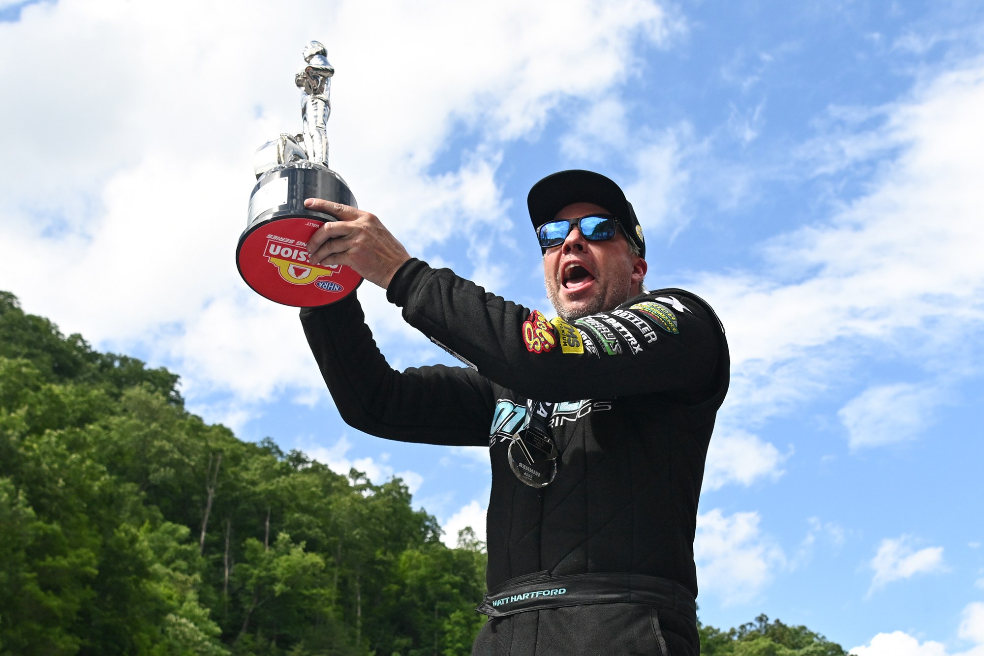 Matt Hartford hoists the Pro Stock Wally at the 2026 Super Grip NHRA Thunder Valley Nationals at Bristol Dragway.