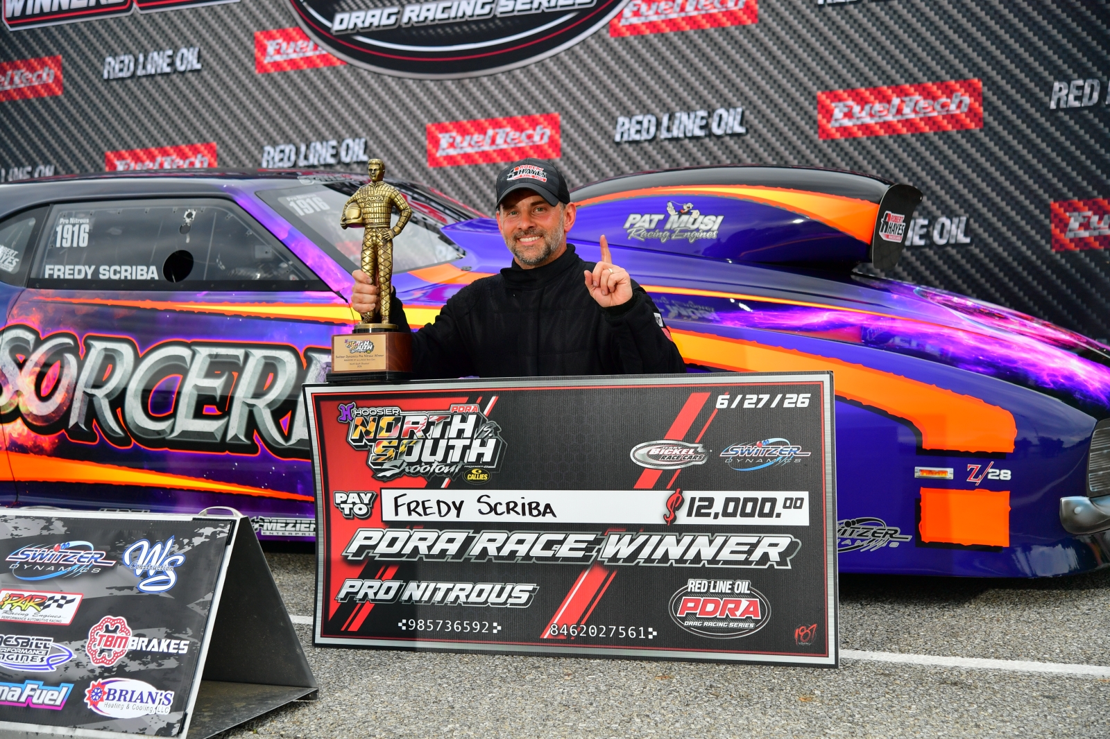 Fredy Scriba in the PDRA winner's circle with the Pro Nitrous trophy