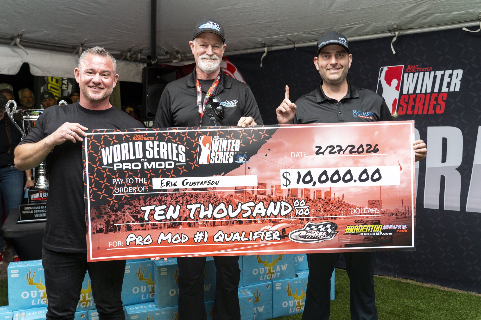 Eric Gustafson and team receive the ,000 Jerry Bickel Race Cars No. 1 qualifier check.