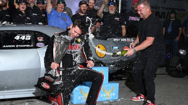Aaron Stanfield is doused with champagne by WSOPM promoter Wes Buck after winning the 2026 World Series of Pro Mod.