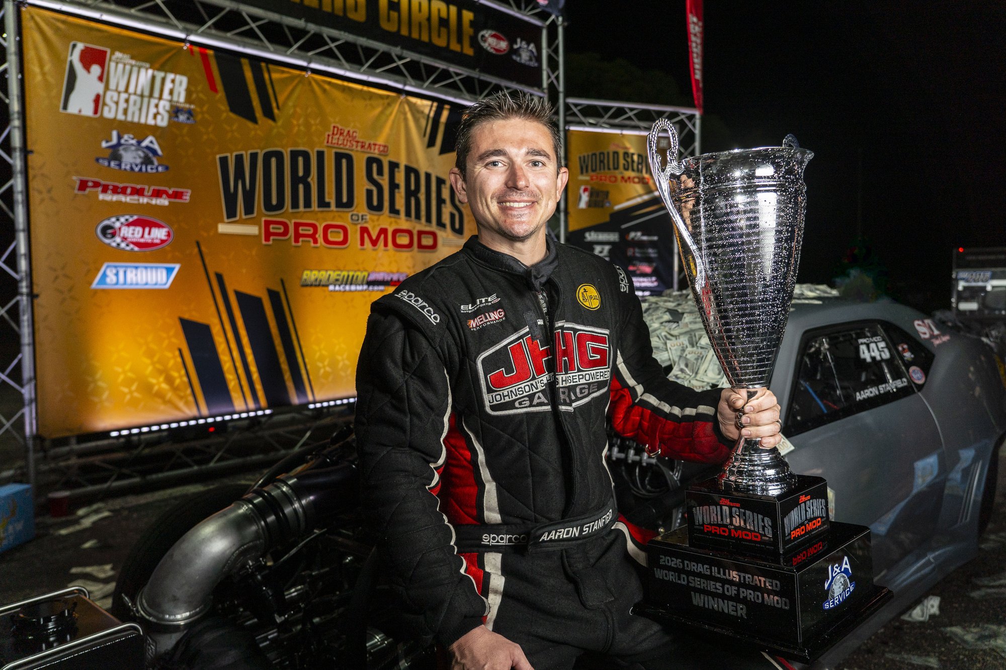 Wes Buck congratulates Aaron Stanfield in the winner's circle.