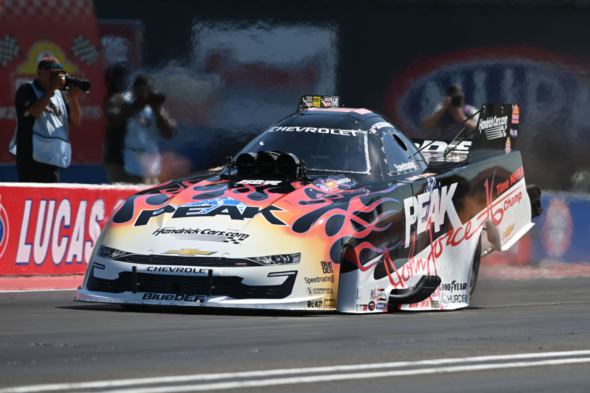 Jack Beckman drives the PEAK Chevrolet Funny Car in the John Force flamed tribute livery at the 2026 NHRA U.S. Nationals
