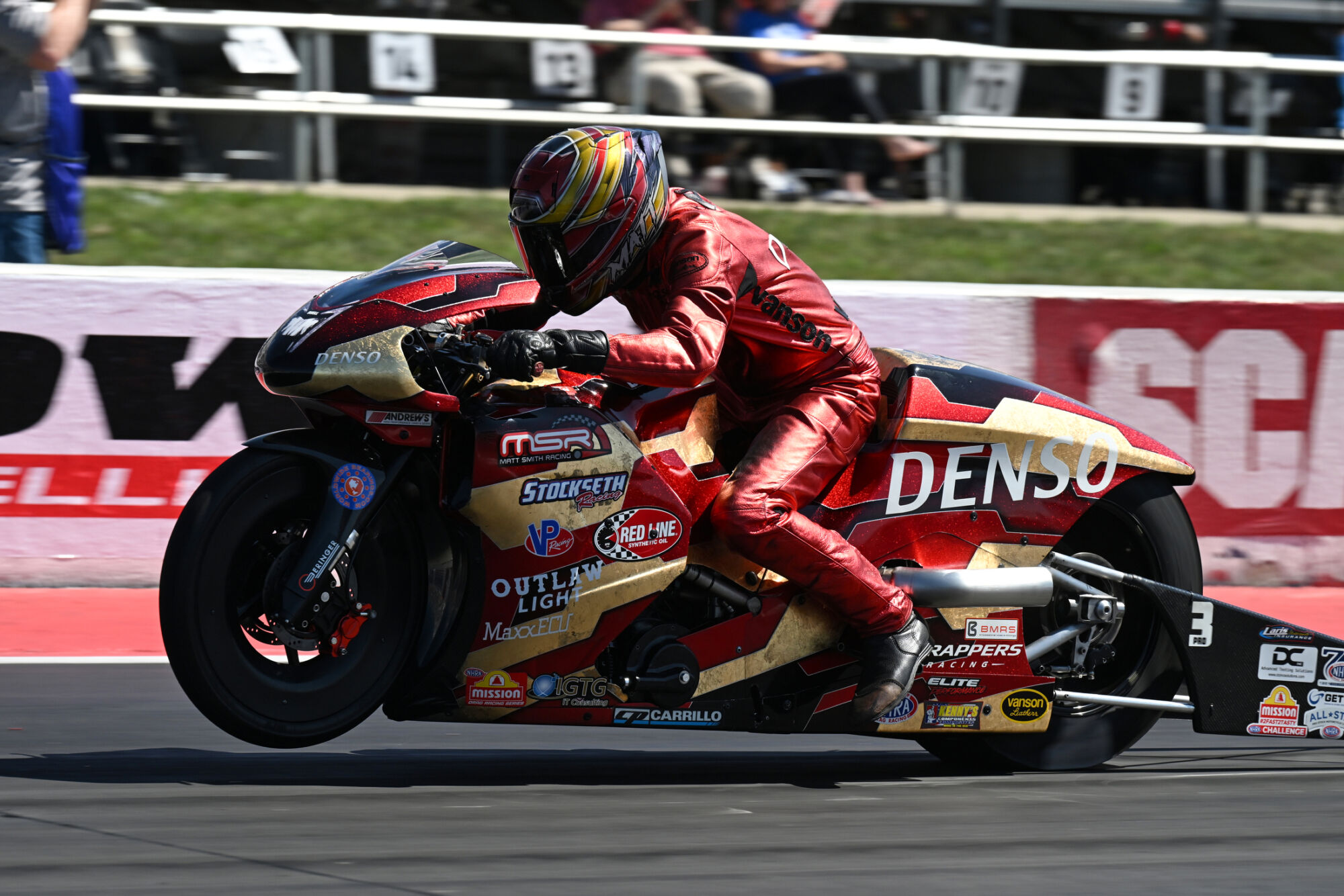 Matt Smith tucked in on the Denso Buell Pro Stock Motorcycle at speed at Lucas Oil Indianapolis Raceway Park