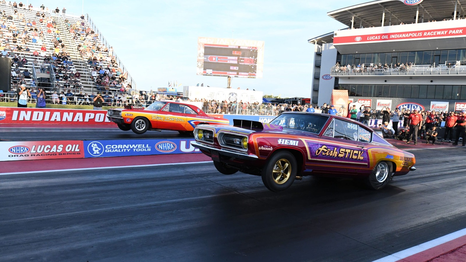 Two Hemi powered Super Stock cars pull the front wheels off the starting line side by side in the Sox and Martin Hemi Challenge at Lucas Oil Indianapolis Raceway Park