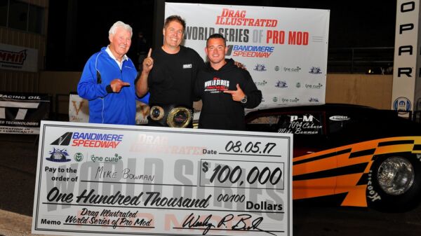 Mike Bowman with the $100,000 check and championship belt after winning the 2017 World Series of Pro Mod at Bandimere Speedway