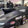 The flat-black Elite Motorsports 2027-spec Pro Stock Camaro with hood scoop at Texas Motorplex