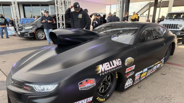 The flat-black Elite Motorsports 2027-spec Pro Stock Camaro with hood scoop at Texas Motorplex