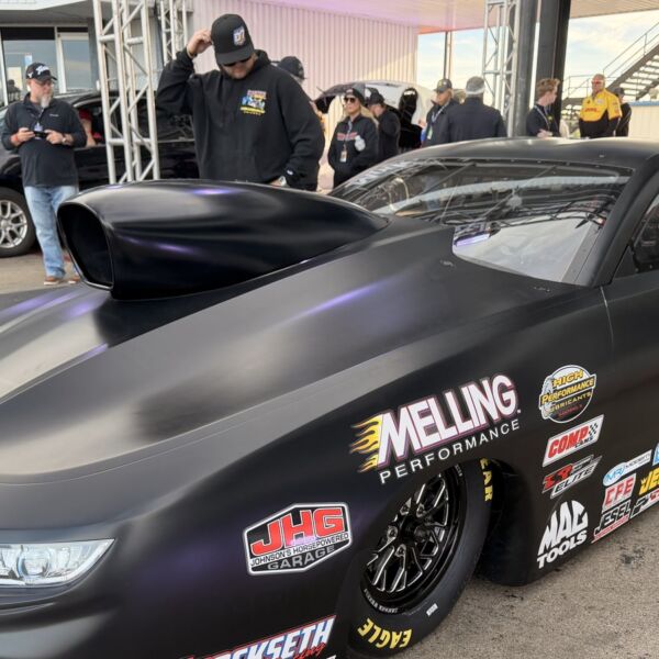 The flat-black Elite Motorsports 2027-spec Pro Stock Camaro with hood scoop at Texas Motorplex