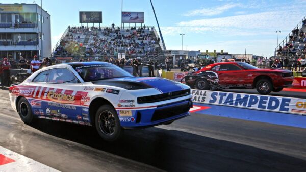 Mark Pawuk's Empaco Dodge Charger launches against Lee Hartman in the Flexjet Factory Stock Showdown final at the Texas Fall Nationals