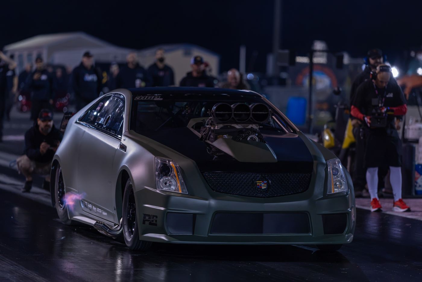 Olive green Cadillac CTS-V with a blower stages during Friday qualifying at No Mercy 17