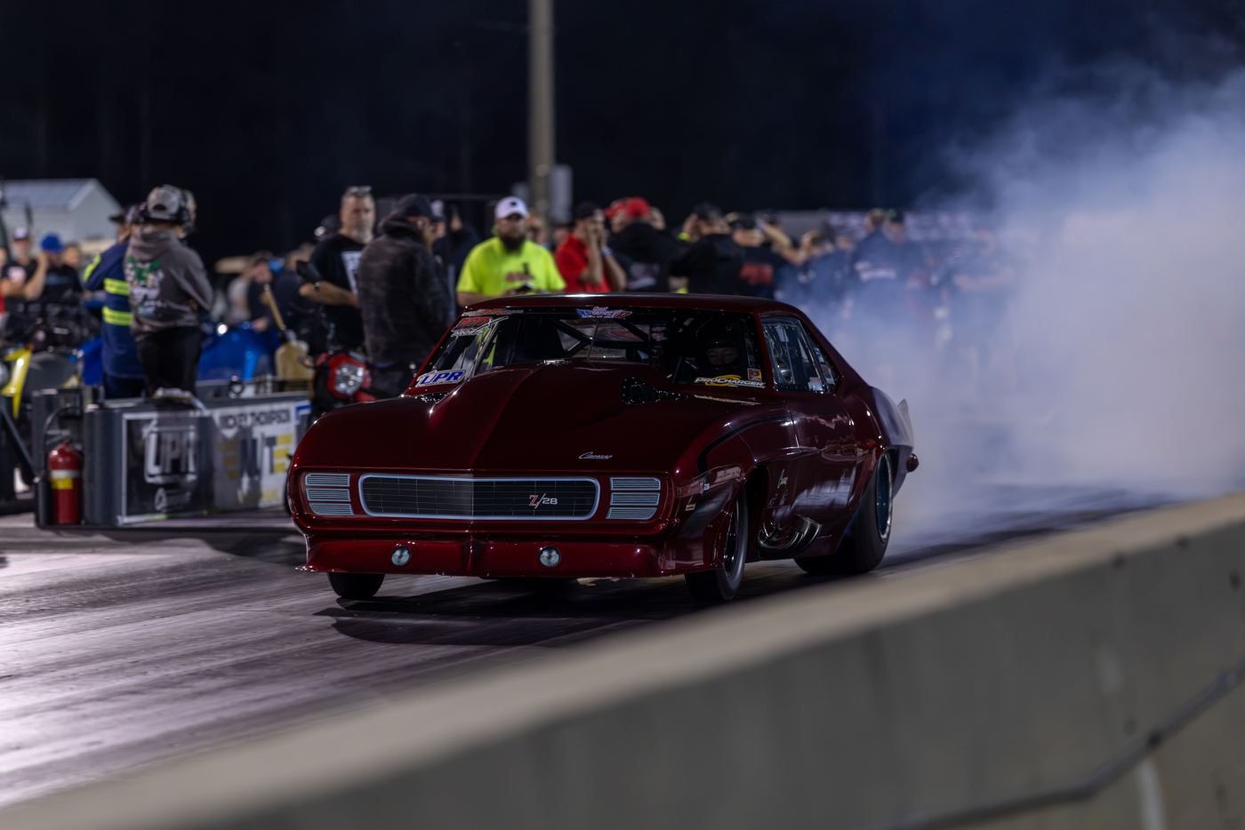 Red 1969 Camaro in the water box with the crowd lining the wall at No Mercy 17